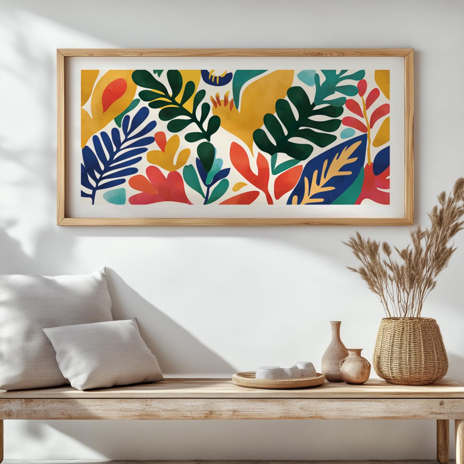 Colorful abstract botanical print in a light wood frame hung above a minimalist bench