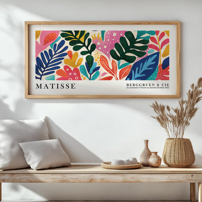 Rectangular Matisse art print in natural wood frame displayed above a wooden bench for scale
