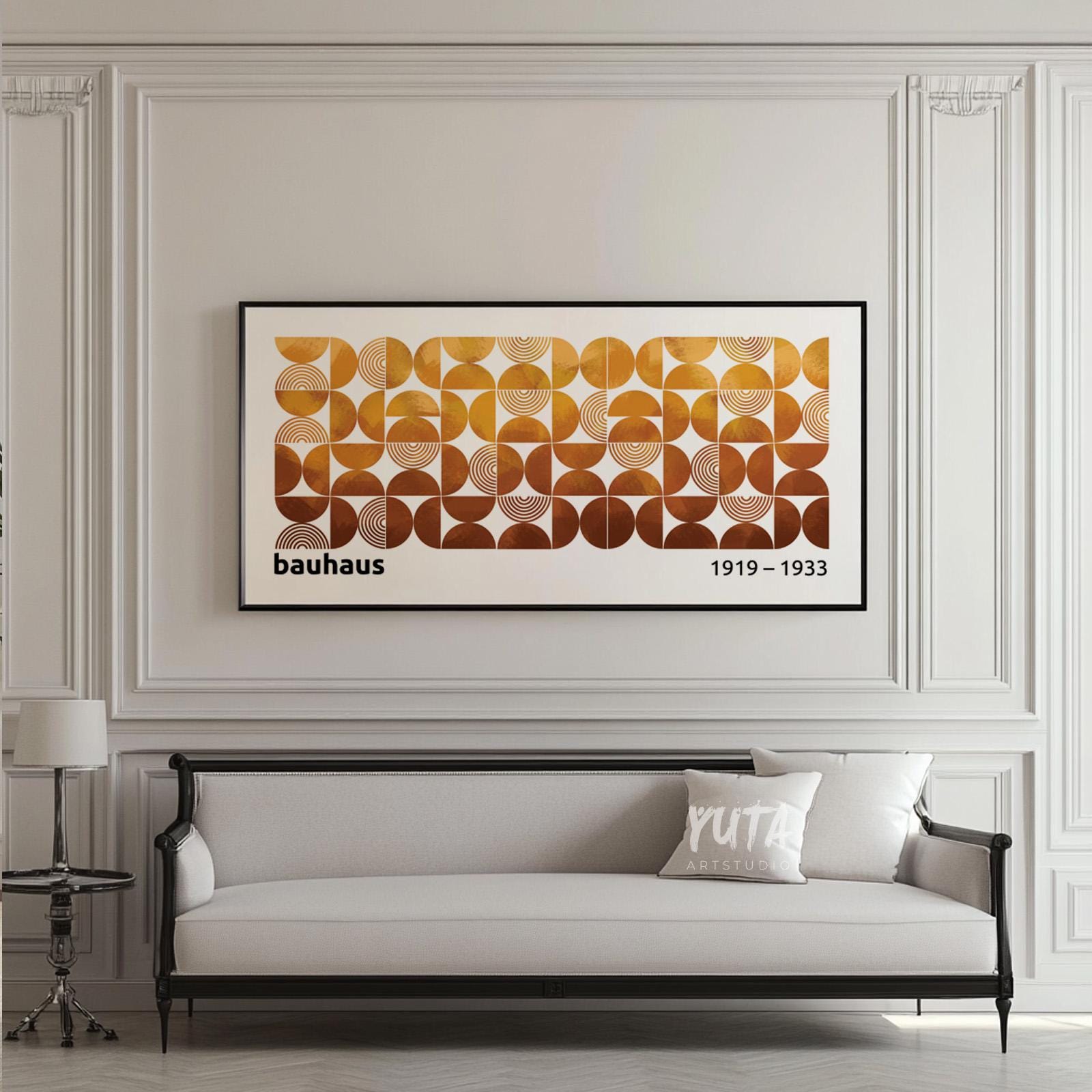 Large panoramic Bauhaus print with modular abstract shapes displayed above a sofa for scale