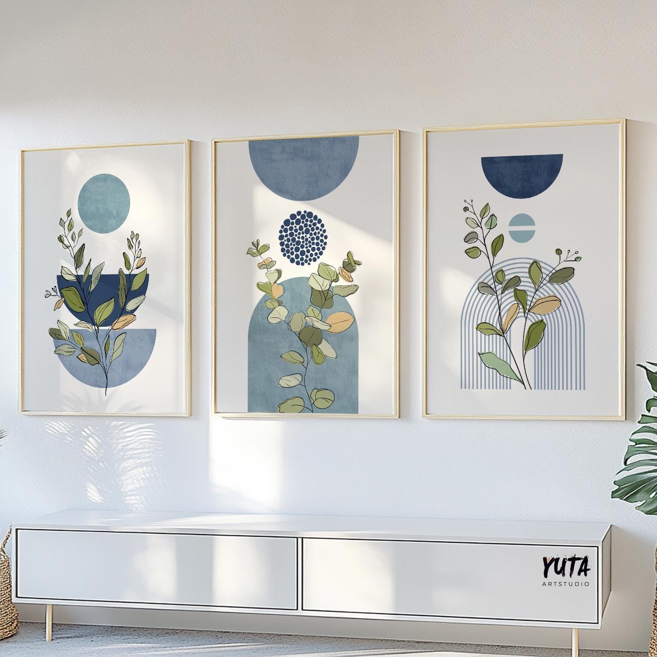 Framed botanical geometric prints shown above a console for size reference and wall spacing