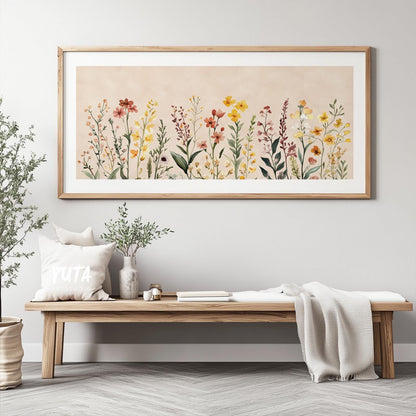 Watercolor wildflowers in soft neutral tones, framed above a wooden bench with decor accents