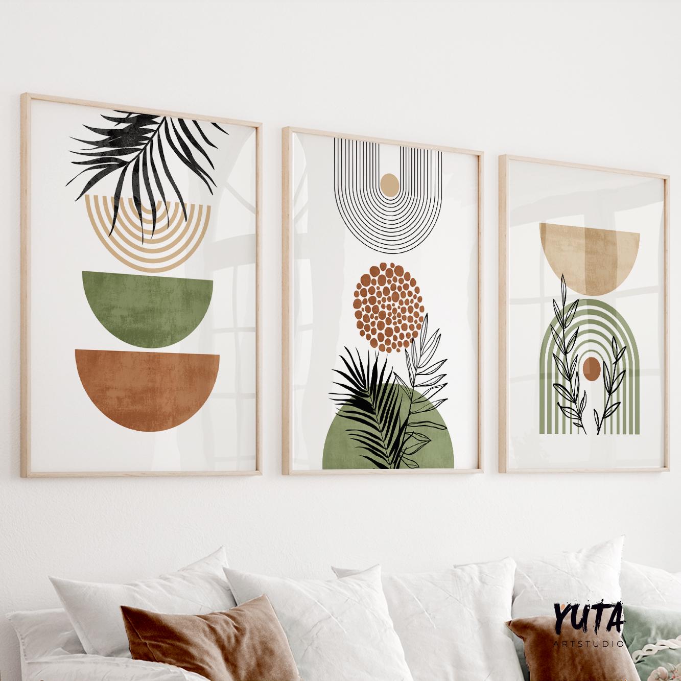 Three framed abstract boho prints with terracotta and green shapes above a white console