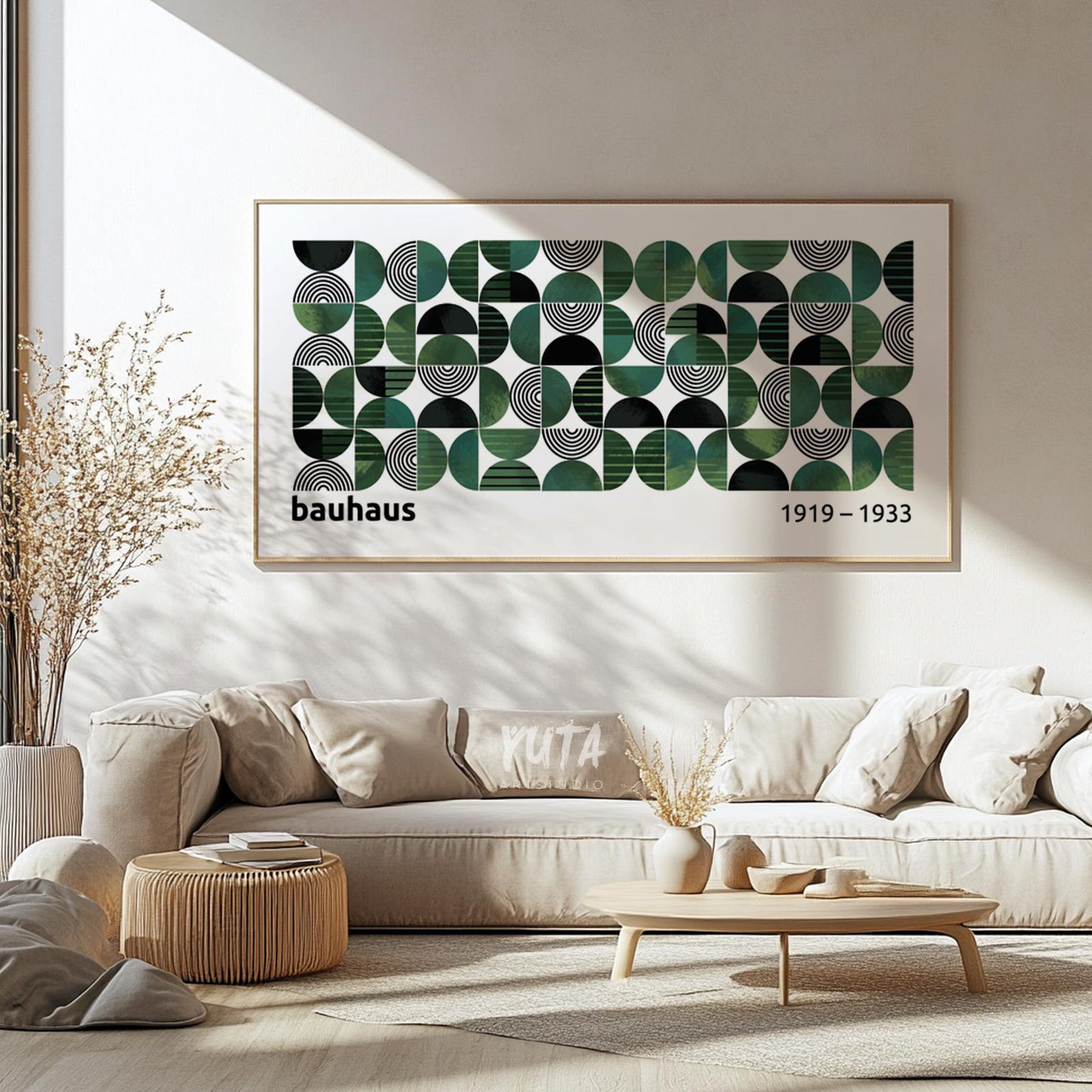Horizontal Bauhaus geometric print in natural wood frame shown above sofa for scale