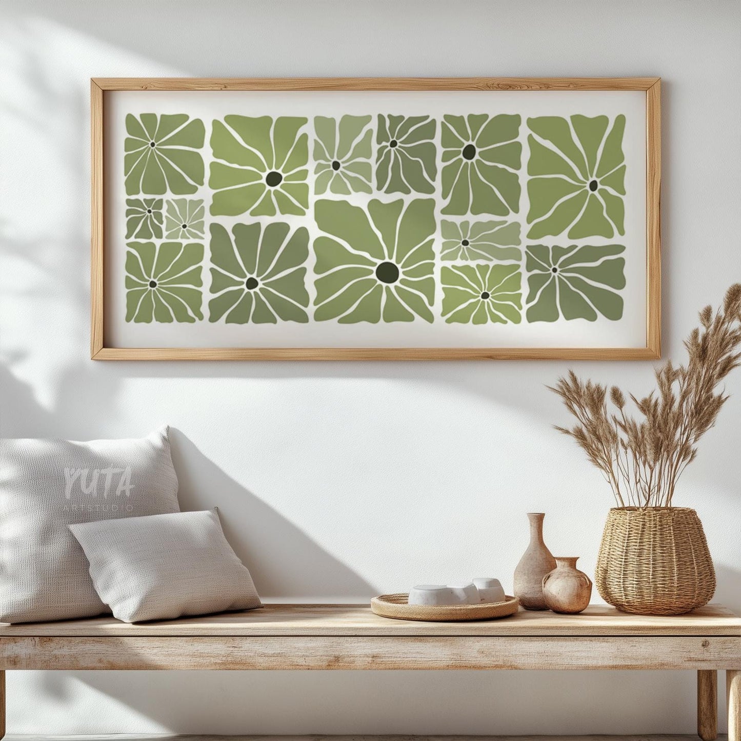 Framed olive green retro floral print with mid-century style, centered above a wooden bench