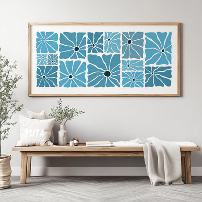 Large framed botanical print with retro blue floral patterns above a wooden bench