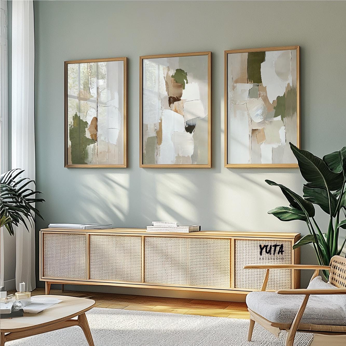 Three framed abstract olive green and beige prints displayed as a gallery above a sideboard