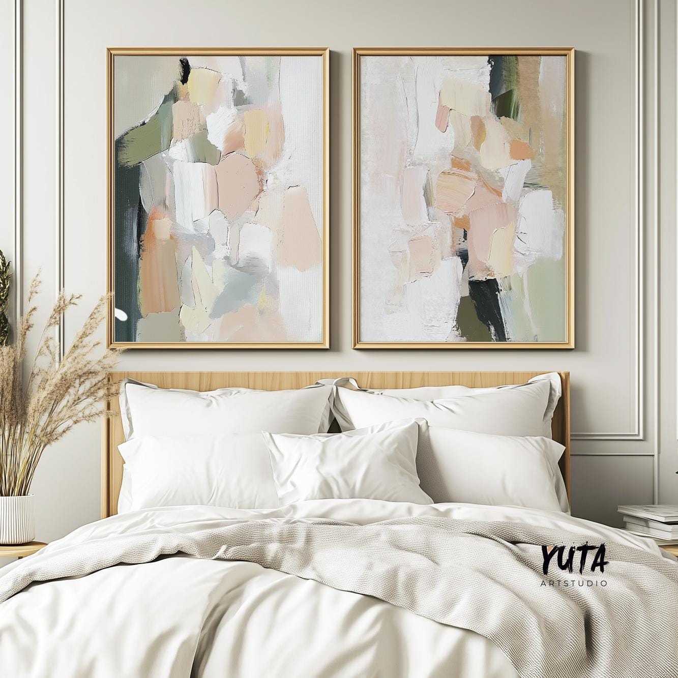Two framed abstract pastel brushstroke prints above a bed with pampas grass in a vase