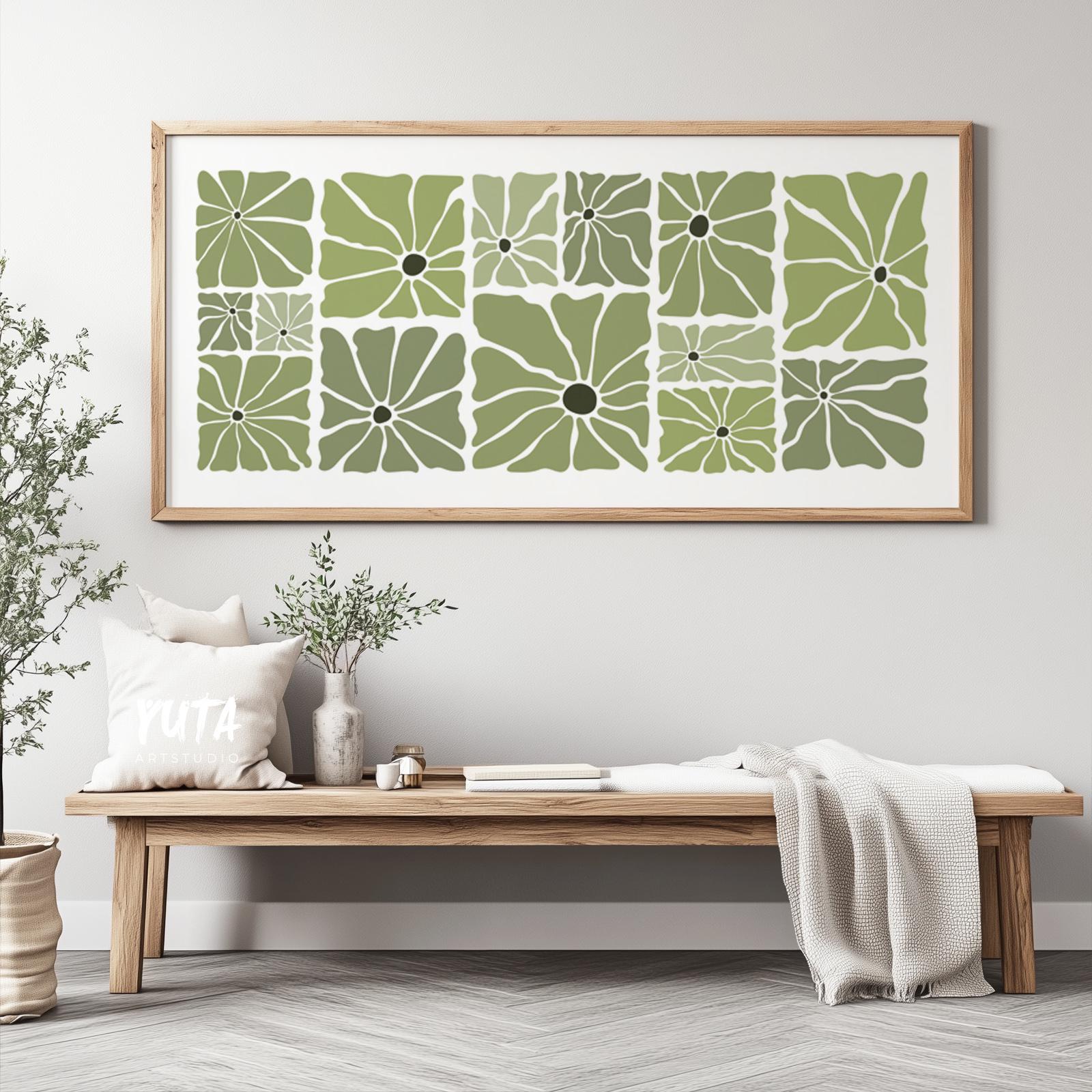 Large framed botanical print in olive green displayed above a wooden bench for scale reference