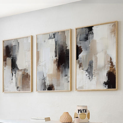 Modern abstract artwork featuring earthy tones with dynamic strokes in cream, brown, and charcoal.