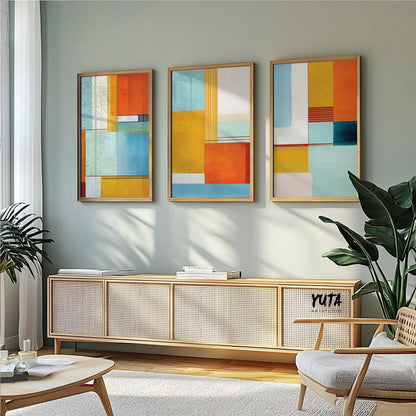 Modern abstract print with intersecting shapes in teal, yellow, blue, and warm orange tones.