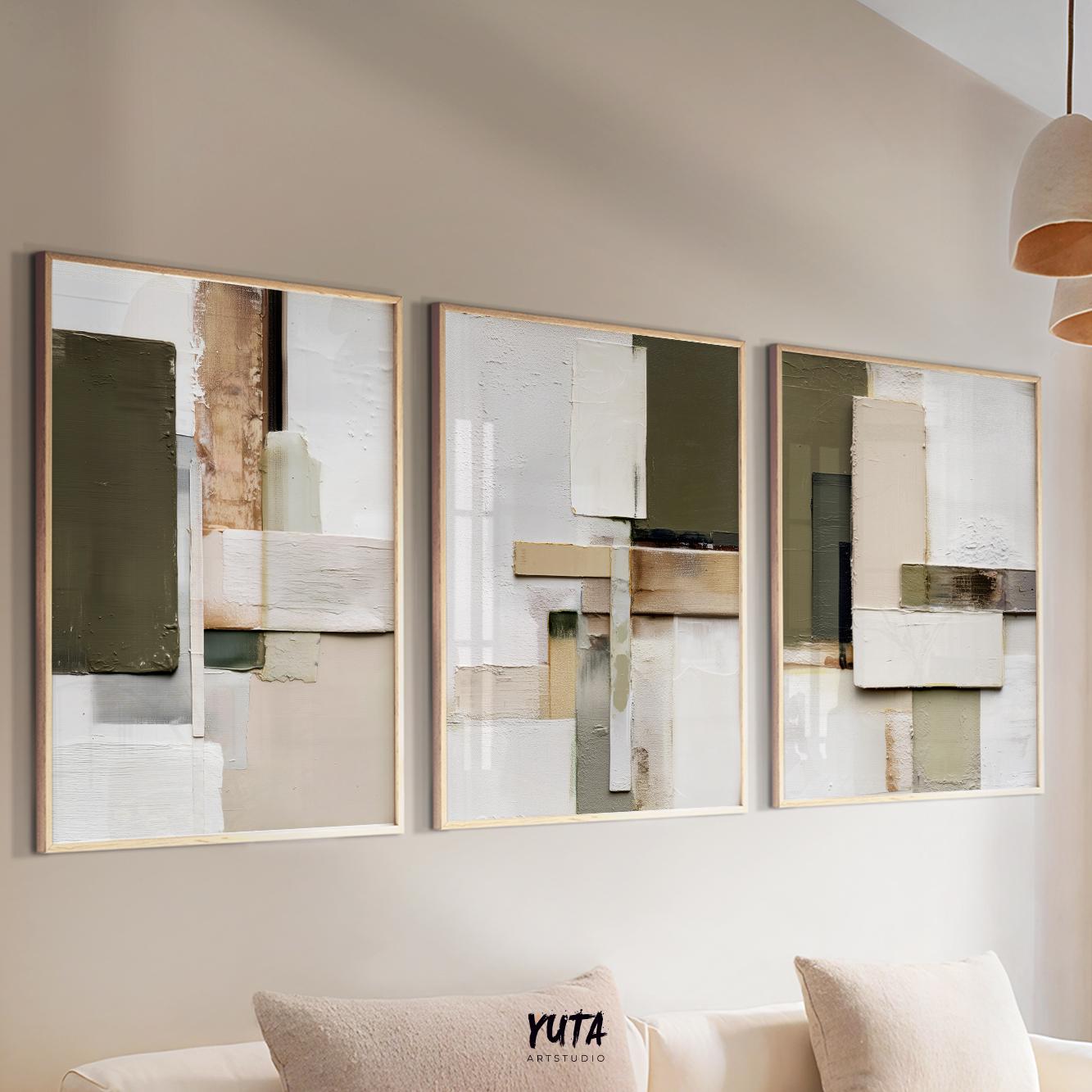 Three framed abstract geometric prints in olive and beige tones displayed above a sofa