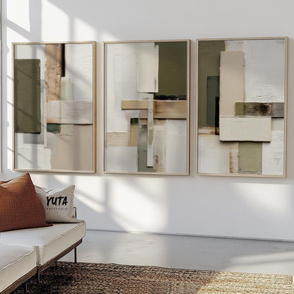 Three-piece neutral abstract geometric art set framed and displayed above a textured rug