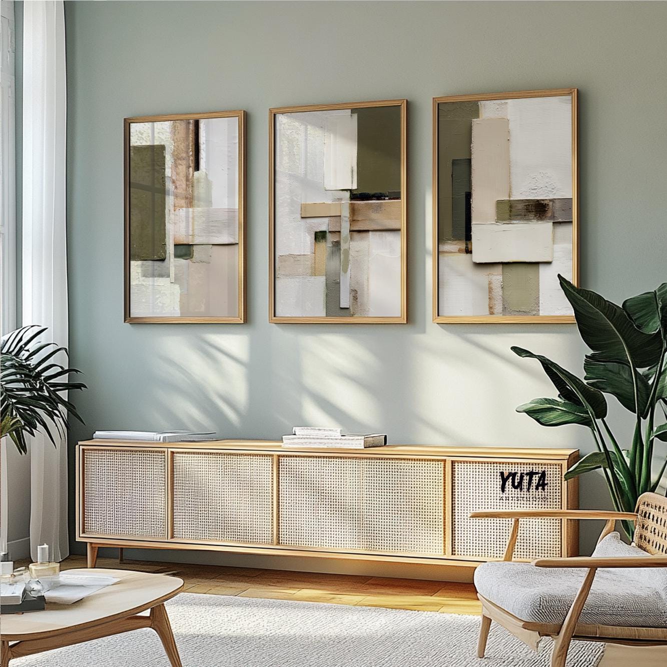 Three framed neutral geometric abstract prints in a triptych above a sideboard, showing artwork scale.