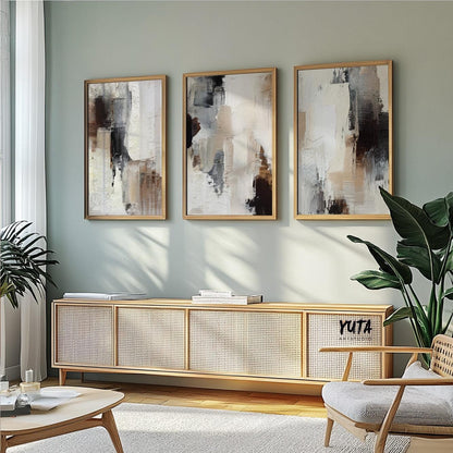 Earthy abstract painting with thick layered textures in ivory, sand, and deep charcoal shades.