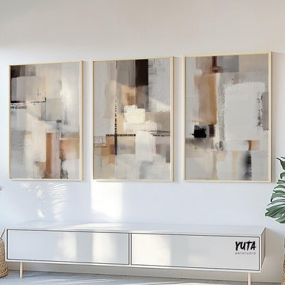 Three-piece neutral abstract art set in light wood frames sized above a modern console