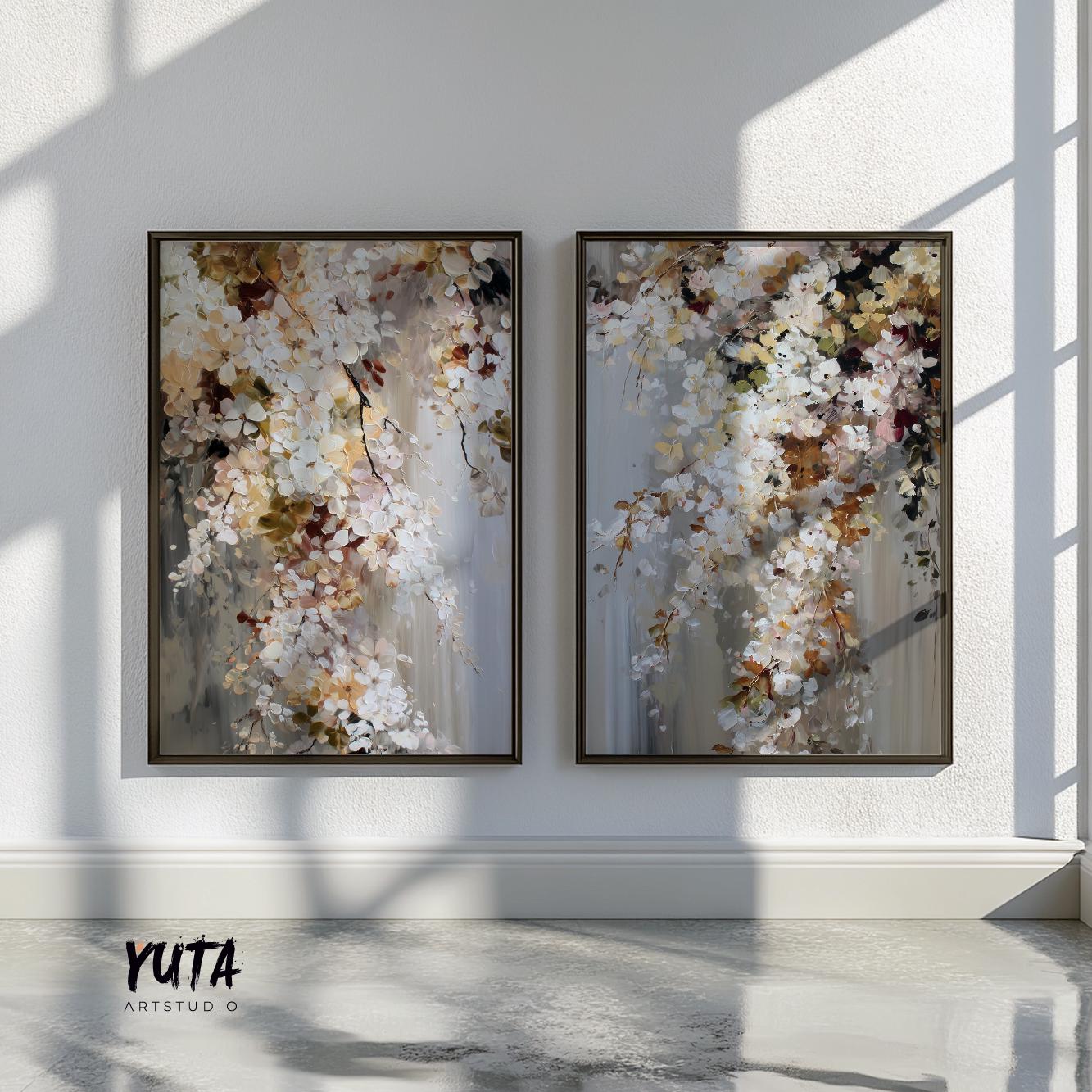 Abstract floral art duo in dark frames displayed above a minimalist sofa setting