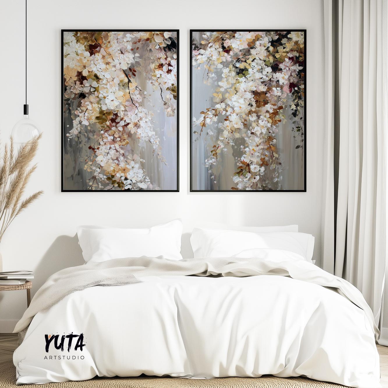 Two large abstract floral prints in black frames displayed above a bed for size reference