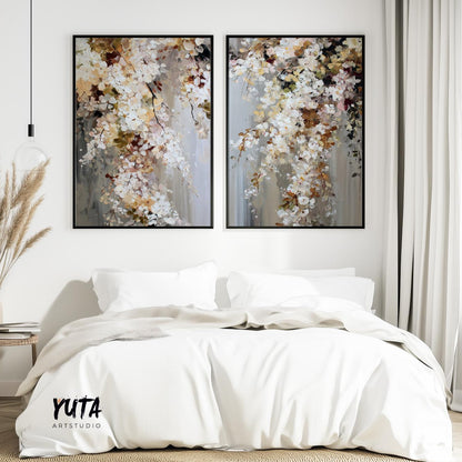 Two large abstract floral prints in black frames displayed above a bed for size reference