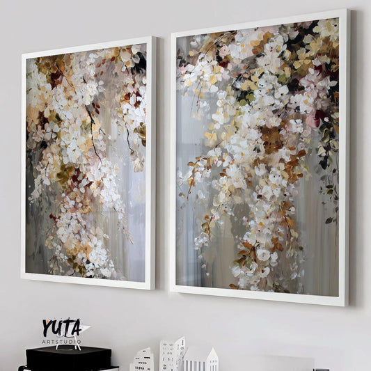 Pair of framed abstract floral paintings with textured brushstrokes above a white console.