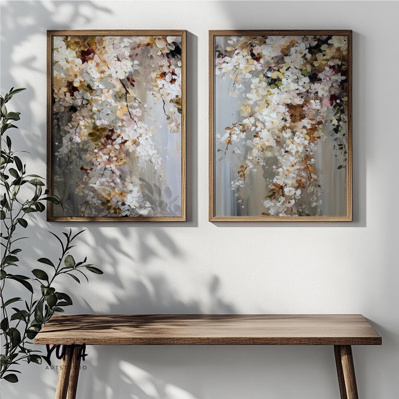 Abstract floral artwork set in natural wood frames displayed side by side above a console