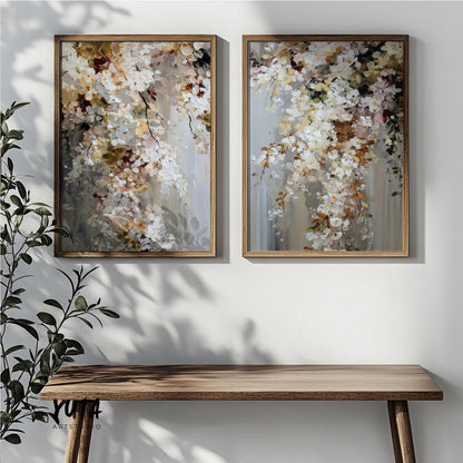 Abstract floral artwork set in natural wood frames displayed side by side above a console