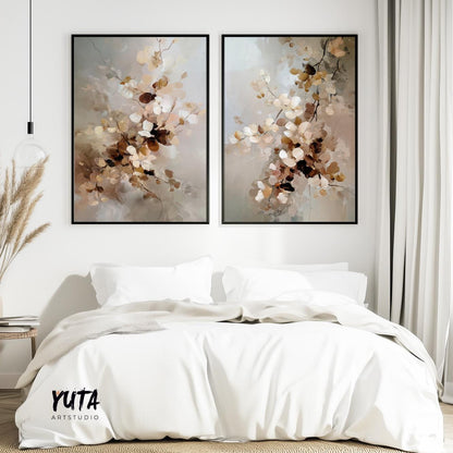 Pair of framed abstract floral prints in muted beige tones displayed above a bed