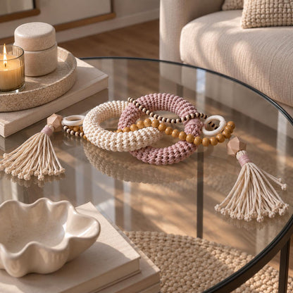 Dusty pink and cream handmade coffee table decor with woven cotton rings, natural wooden beads and tassels