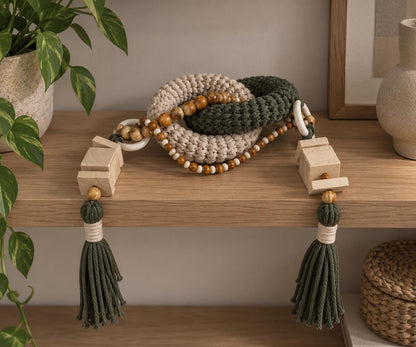Handmade shelf decor object with chunky olive and beige woven links and natural wooden accents