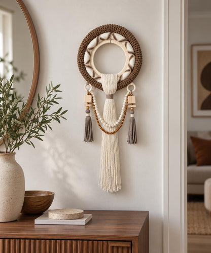 Round woven wall hanging displayed on a light wall in a neutral modern living room