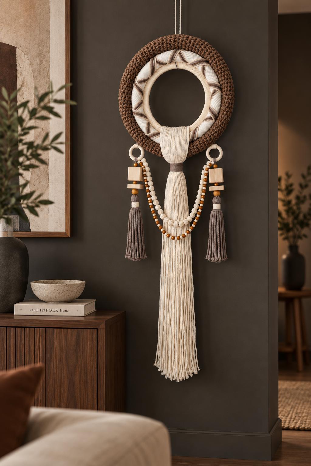 Handmade woven wall hanging with layered round design, wooden details and long central tassel