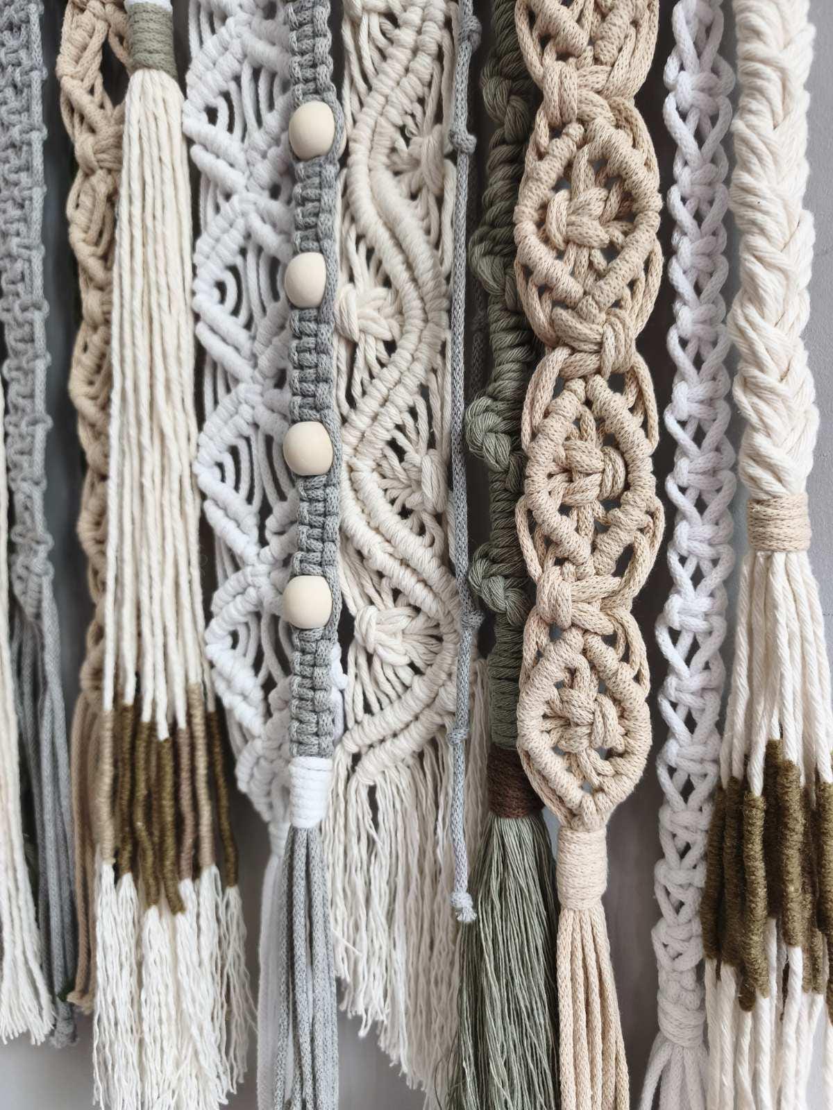 Sculptural fiber wall art with multiple handmade macrame patterns and natural colors