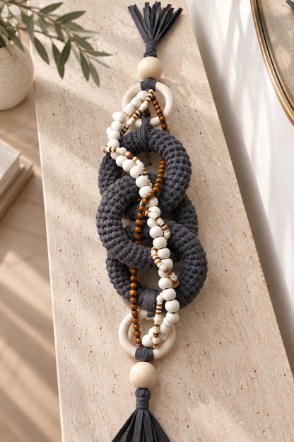 Handmade shelf decor with chunky gray fiber links, natural wooden rings and decorative beads
