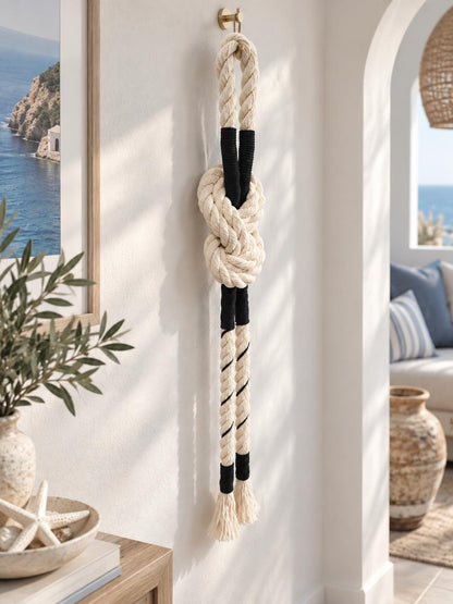 Decorative rope knot wall hanging styled in a modern coastal living space