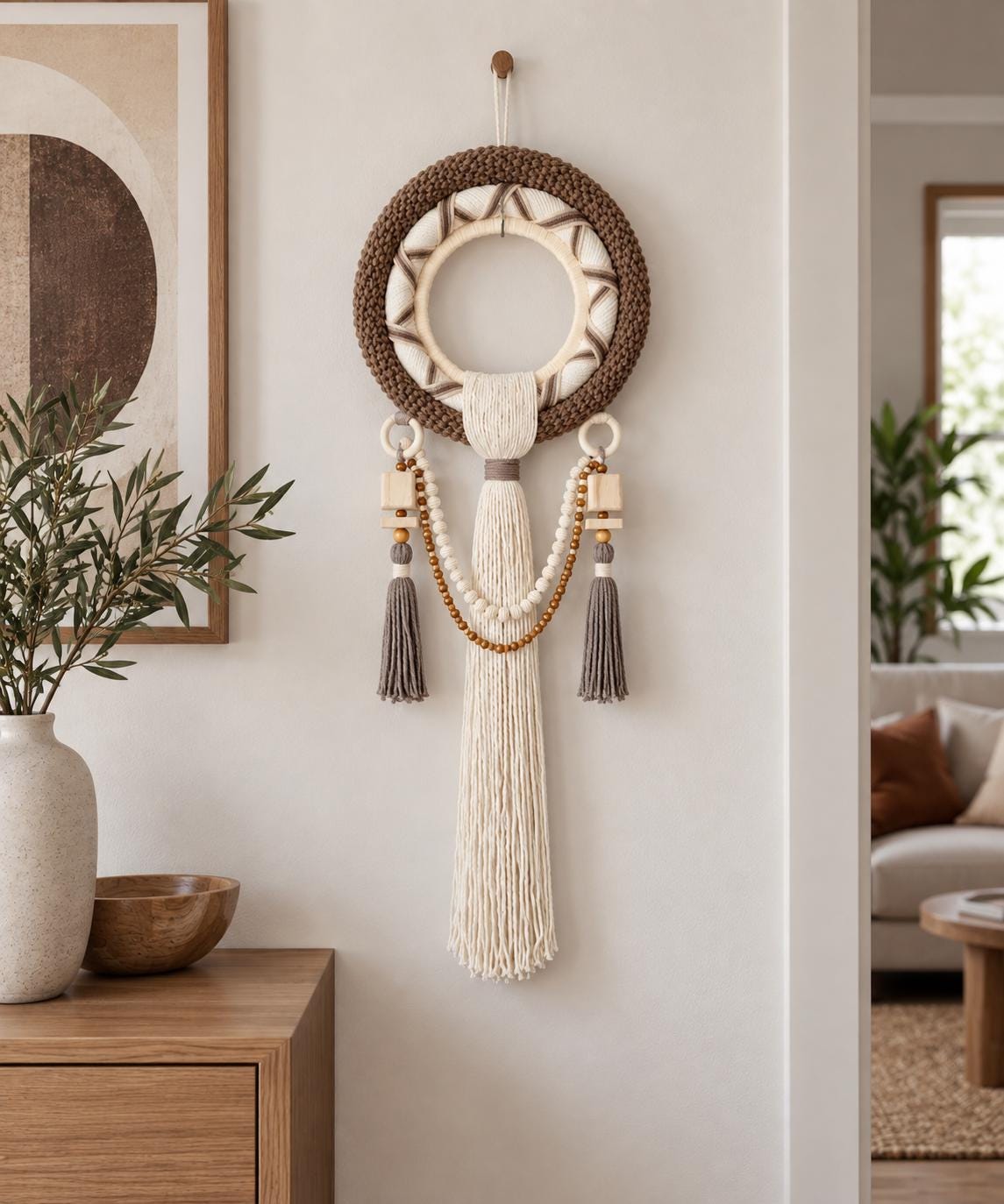 Handmade round macrame wall hanging in brown, cream and taupe with wooden beads and decorative tassels