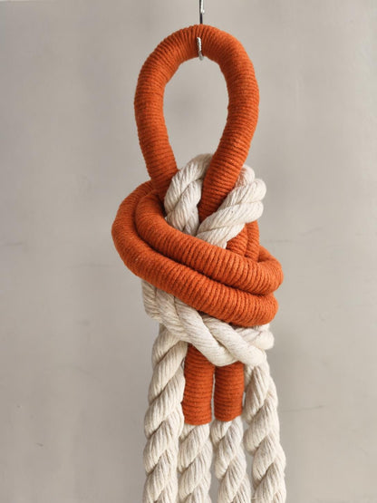 Textured rope wall art with cream cotton cord and terracotta orange accents