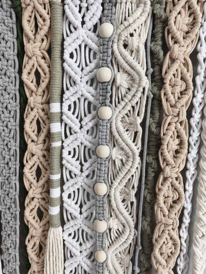 Close up of textured macrame knots in cream, sage green, beige and soft gray