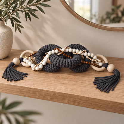 Handmade textile chain decor styled as a sculptural accent for a console or shelf
