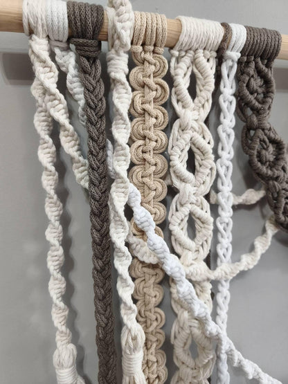 Detailed macrame knotwork with twisted cords and long cream tassels