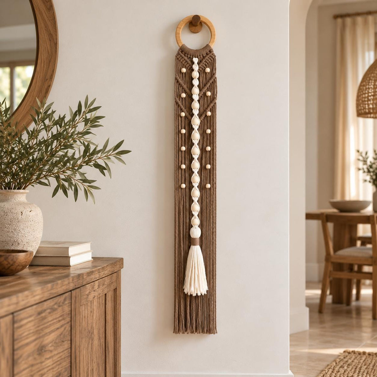 Mocha brown vertical macrame wall hanging displayed against a light neutral wall
