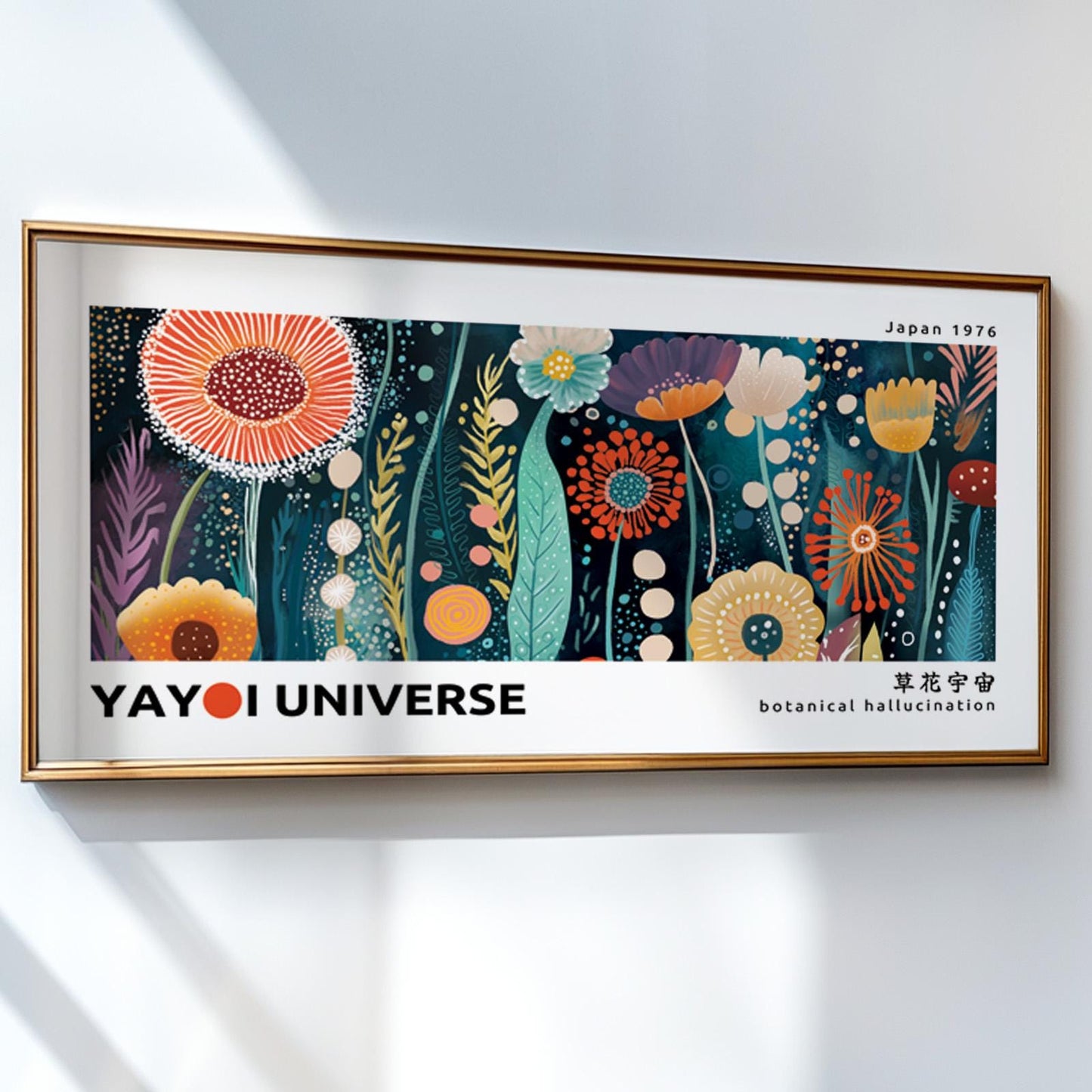 Colorful botanical exhibition artwork with abstract floral forms in a gold frame on white wall
