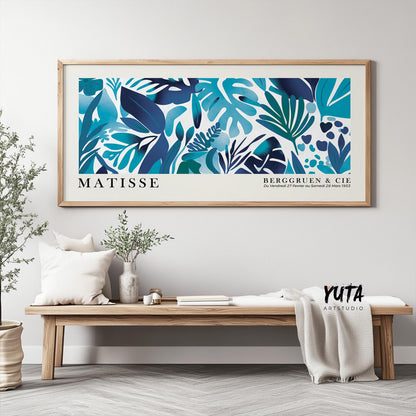 Framed Matisse style tropical leaves print shown in large horizontal wall size above a bench