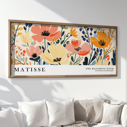 Oversized Matisse-inspired floral artwork with bold botanical shapes in a wood frame above a sofa