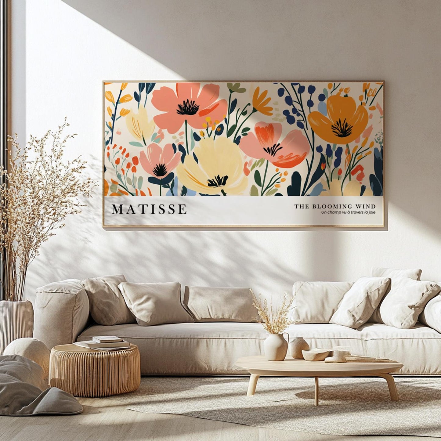 Horizontal Matisse-inspired floral artwork in a wood frame hung above a beige sofa.