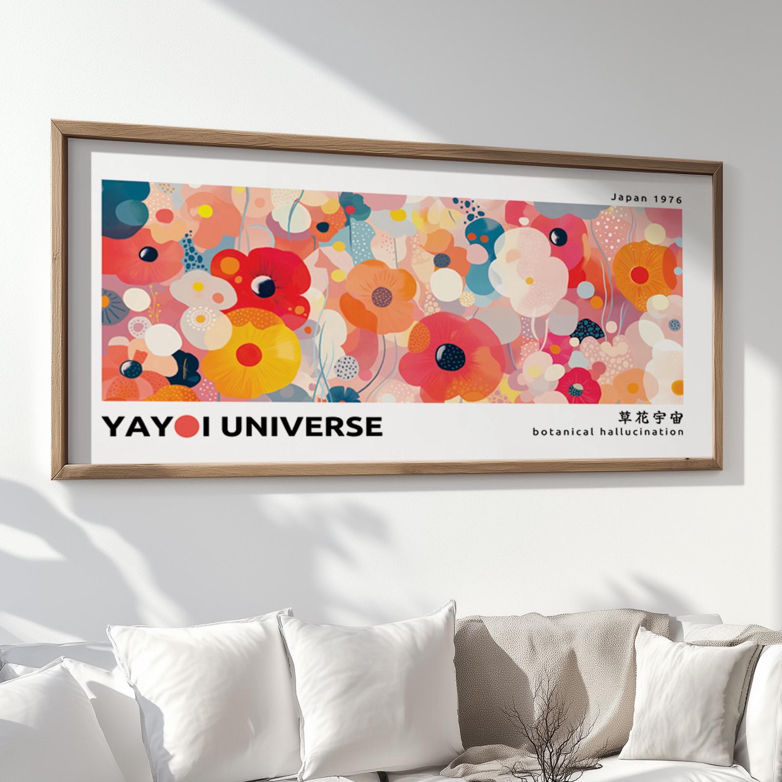 Framed abstract floral artwork in bold pinks and yellows displayed above a white sofa.