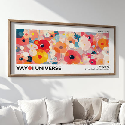 Framed abstract floral artwork in bold pinks and yellows displayed above a white sofa.