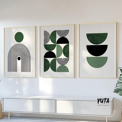 Three geometric Bauhaus prints in gold frames shown above a white sideboard for scale