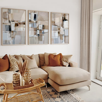 Minimalist abstract wall art triptych with layered beige and gray shapes, black details and textured line patterns.