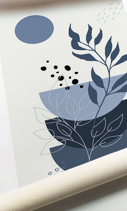 Botanical gallery wall combining dusty blue leaves with modern geometric forms