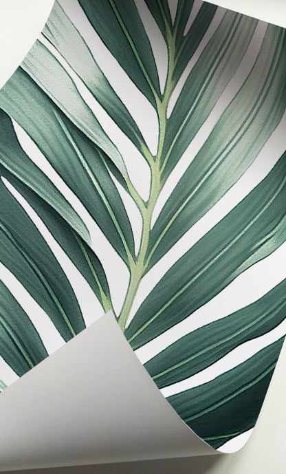 Green botanical wall art with oversized tropical foliage