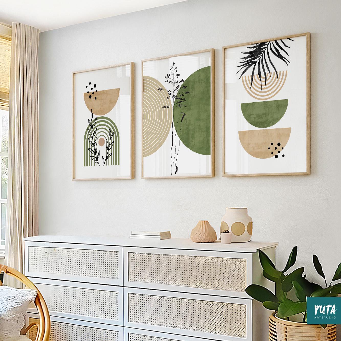 Trio of framed abstract green and beige prints in a linear arrangement above a white dresser